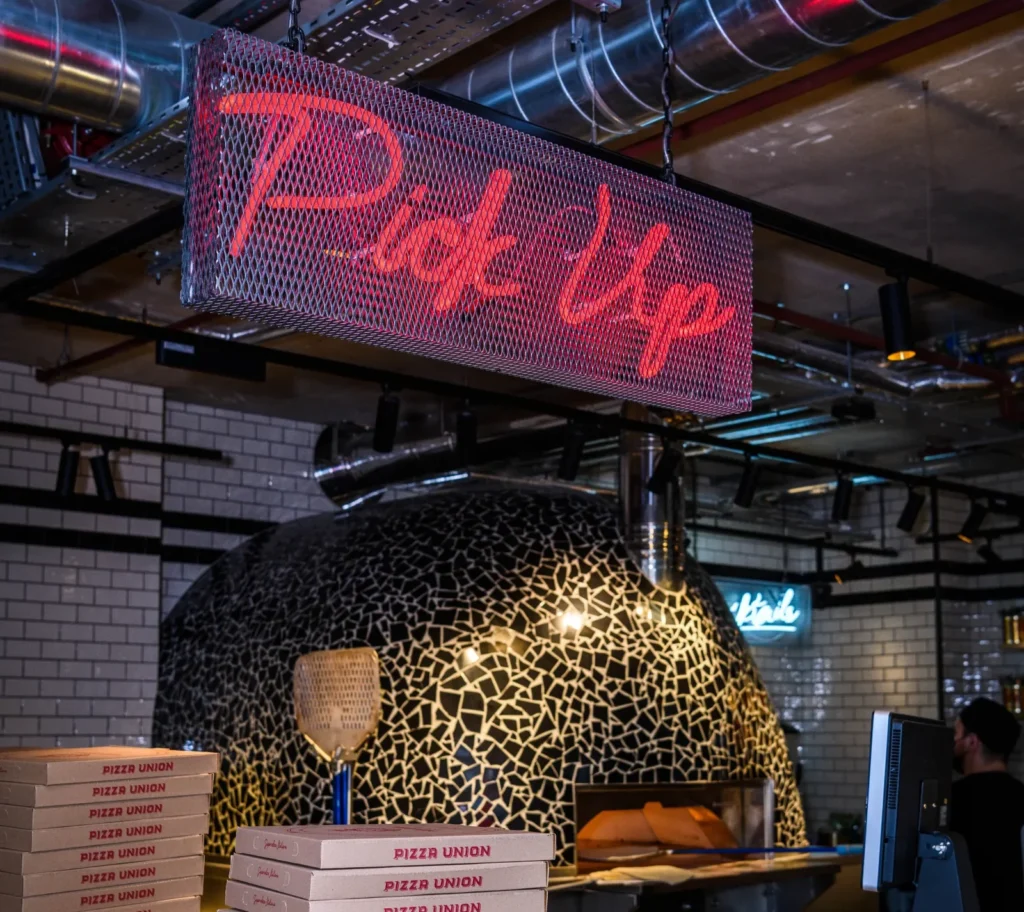 Pick Up counter and pizza oven at Pizza Union Hoxton